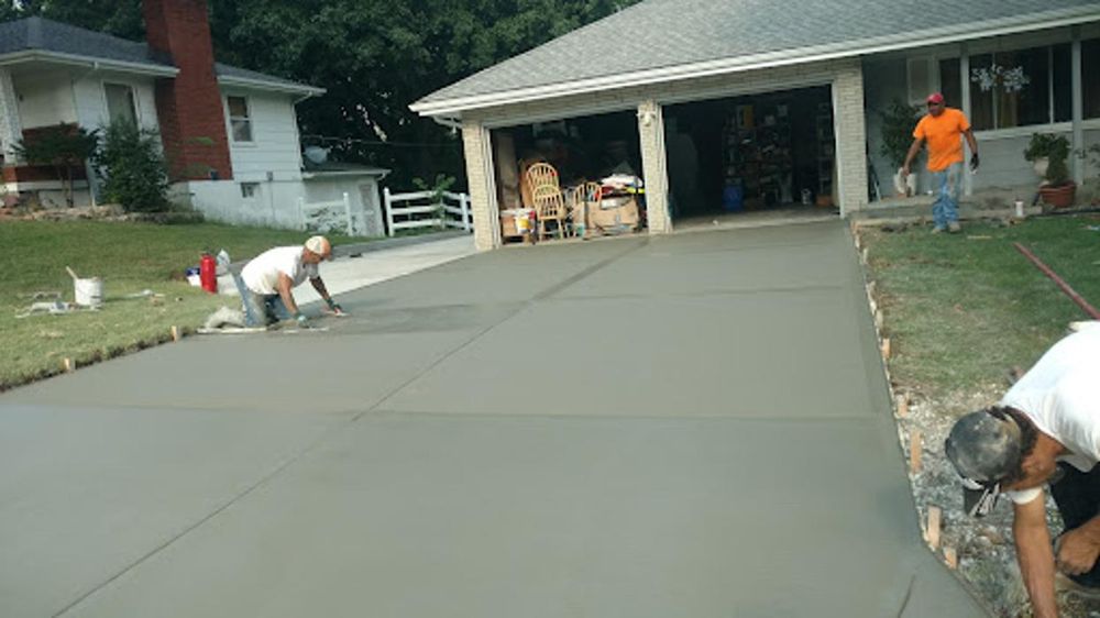 Ford Concrete crew finishing a residential driveway pour in the Kansas City Northland